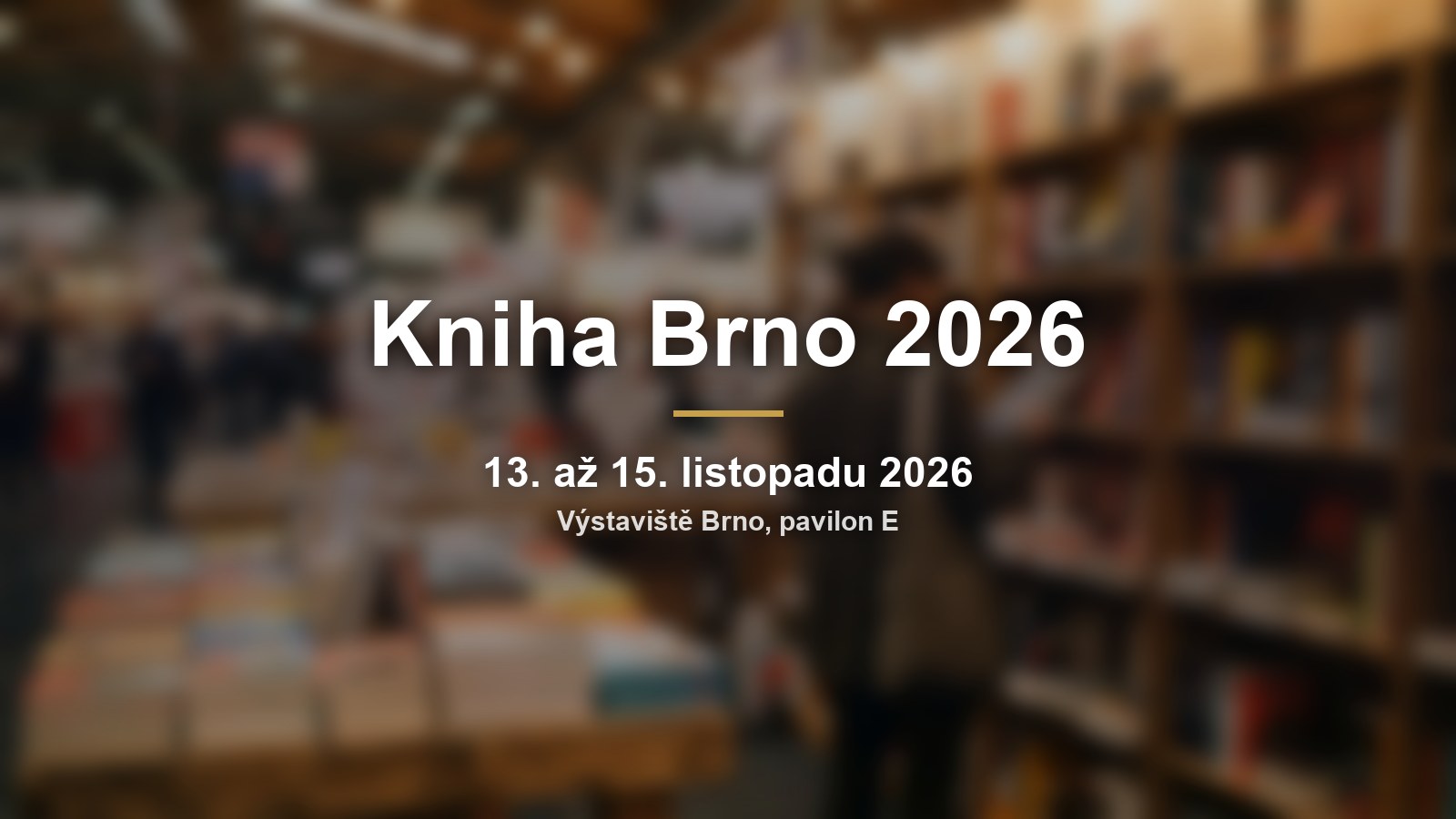 Rozmazaný knižní stánek s nápisem Kniha Brno 2026 a termínem