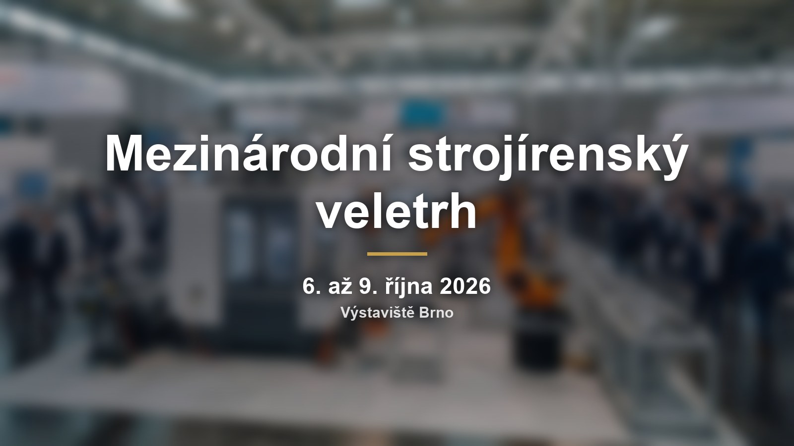 Rozmazaná veletržní hala s názvem Mezinárodní strojírenský veletrh a termínem