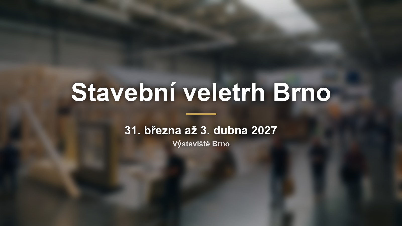 Rozmazaná stavební expozice s nápisem Stavební veletrh Brno a termínem
